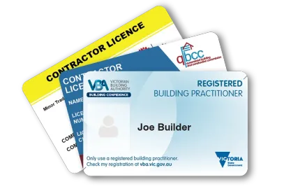 Stack of contractor license cards, including a blue registered building practitioner card on top.